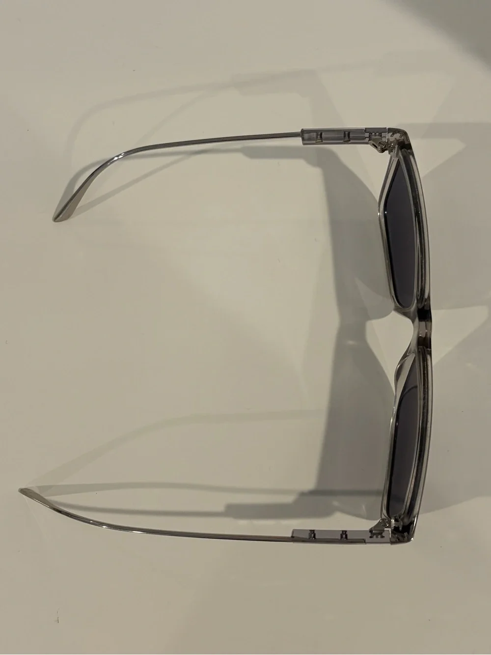 Prada Men’s Clear Frame Sunglasses with Dark Blue Lenses